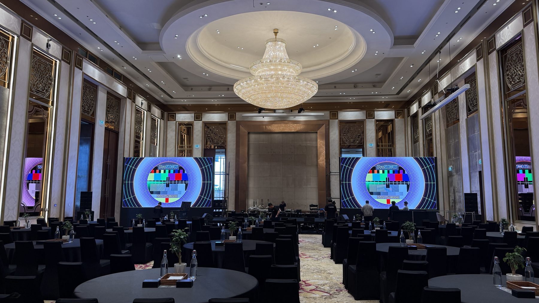 Nutanix Global Tech Summit ballroom set with chandeliers, LED wall and dressed rounds