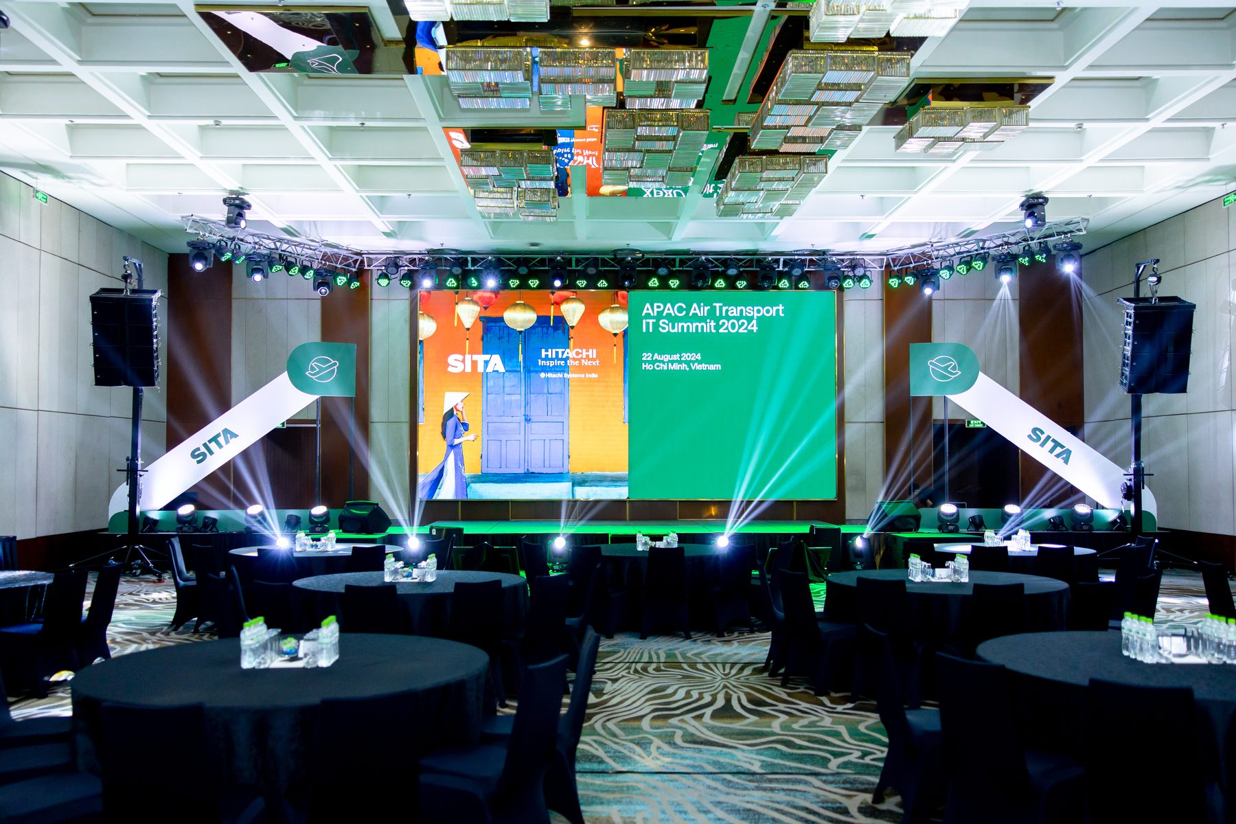 SITA APAC Air Transport IT Summit plenary set with a wide green-lit LED wall