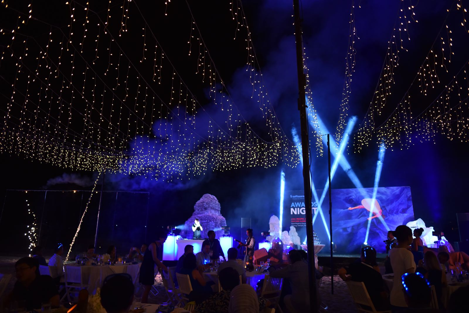 Evening awards stage under a canopy of lights, scenic build and show lighting